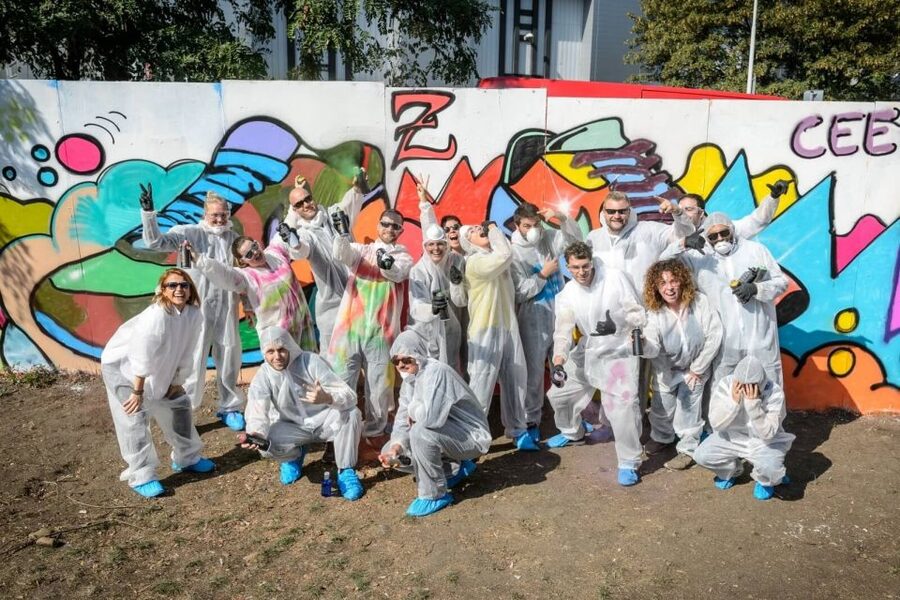 Prague Graffiti Workshop For Groups & Team-Building Groups - Painting on the prepared black wall