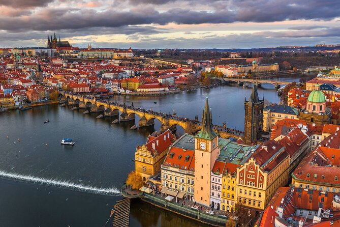 Prague Guided Walking Tour and Cruise with Authentic Czech Lunch - Crossing Charles Bridge before the crowds build