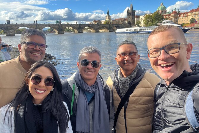 Prague Highlights 4 Hour Private Walking Tour - Crossing Charles Bridge toward the Lesser Town