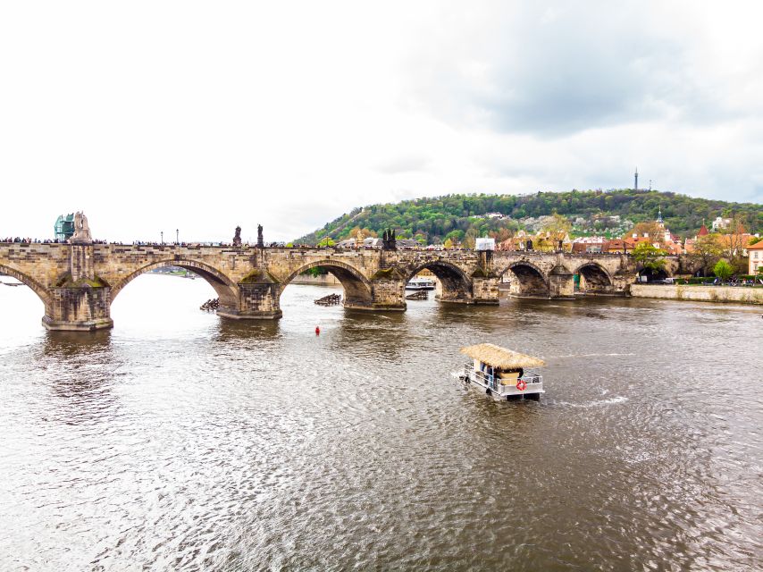 Prague: Party Tiki Boat Sightseeing Cruise with Drinks - Seeing Charles Bridge from the water