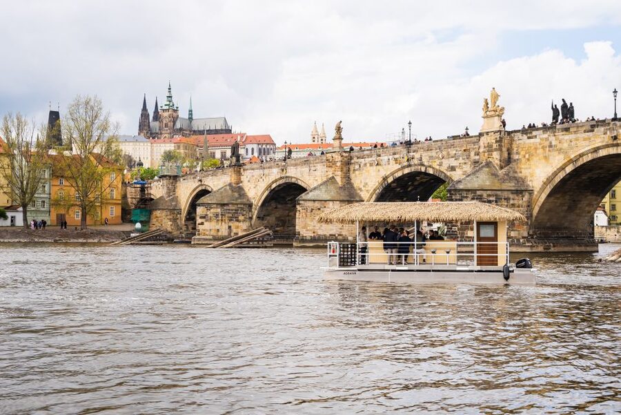 Prague: Party Tiki Boat Sightseeing Cruise with Drinks - Meeting the boat between two river landmarks