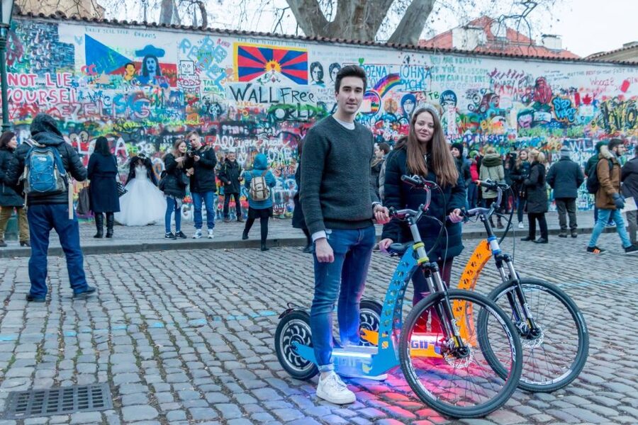 Prague: Tour by Electric Scooter or Cruiser eBike - Charles Bridge, the narrow alley, and the riverfront