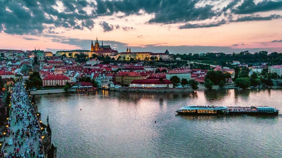 Prague: Vltava River Night Cruise with Buffet - Dancing House and the view toward Prague Castle