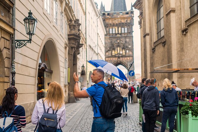 Prague Walking Tour with River Boat Cruise and Lunch - 6 hours - Crossing Charles Bridge and riding uphill